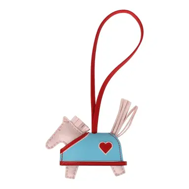 HERMÈS Hermes Rodeo Robeo Coeur Charm PM Rose Darling, Bleu Celeste & Rouge Radieux Milo Lambskin | Thumbnail 1 HERMÈS Hermes Rodeo Robeo Coeur Charm PM Rose Darling, Bleu Celeste & Rouge Radieux Milo Lambskin | Thumbnail 1