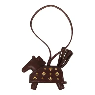 HERMÈS Hermes Rodeo Rock Bag Charm PM Terre Milo Lambskin Gold Hardware | Thumbnail 1 HERMÈS Hermes Rodeo Rock Bag Charm PM Terre Milo Lambskin Gold Hardware | Thumbnail 1
