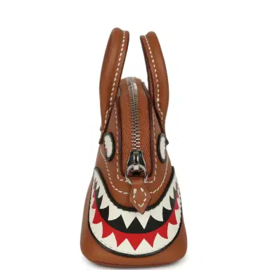 HERMÈS Hermes Mini Bolide Shark Bag Charm Gold and White Swift Palladium Hardware | Thumbnail 3 HERMÈS Hermes Mini Bolide Shark Bag Charm Gold and White Swift Palladium Hardware | Thumbnail 3