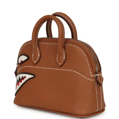 HERMÈS Hermes Mini Bolide Shark Bag Charm Gold and White Swift Palladium Hardware | Thumbnail 4 HERMÈS Hermes Mini Bolide Shark Bag Charm Gold and White Swift Palladium Hardware | Thumbnail 4