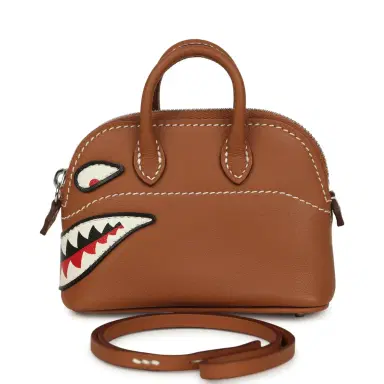 HERMÈS Hermes Mini Bolide Shark Bag Charm Gold and White Swift Palladium Hardware | Thumbnail 1 HERMÈS Hermes Mini Bolide Shark Bag Charm Gold and White Swift Palladium Hardware | Thumbnail 1