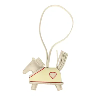 HERMÈS Hermes Rodeo Robeo Coeur Charm PM Craie, Jaune Milton & Rouge Radieux Milo Lambskin | Thumbnail 1 HERMÈS Hermes Rodeo Robeo Coeur Charm PM Craie, Jaune Milton & Rouge Radieux Milo Lambskin | Thumbnail 1
