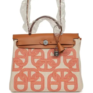 HERMÈS Hermes Herbag Zip PM 31 "Circuit 24" Ecru, Orange Toile H Plume and Natural Vache Hunter Palladium Hardware | Thumbnail 1 HERMÈS Hermes Herbag Zip PM 31 "Circuit 24" Ecru, Orange Toile H Plume and Natural Vache Hunter Palladium Hardware | Thumbnail 1