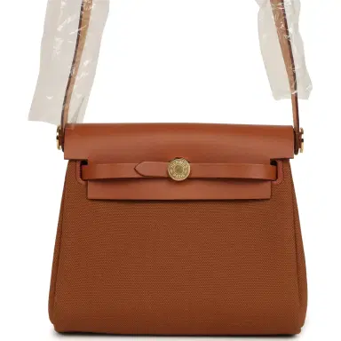 HERMÈS Hermes Herbag Zip 20 Mini Fauve Toile H Canvas and Vache Hunter Gold Hardware | Thumbnail 1 HERMÈS Hermes Herbag Zip 20 Mini Fauve Toile H Canvas and Vache Hunter Gold Hardware | Thumbnail 1