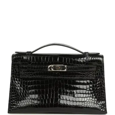 HERMÈS Pre-owned Hermes Kelly Pochette Black Shiny Porosus Crocodile Palladium Hardware | Thumbnail 1 HERMÈS Pre-owned Hermes Kelly Pochette Black Shiny Porosus Crocodile Palladium Hardware | Thumbnail 1