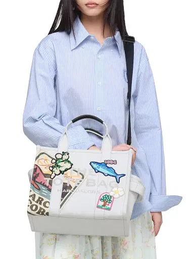 Marc Jacobs Women's The Camp Patchwork Denim Tote Bag - Light Wash | Thumbnail 1 Marc Jacobs Women's The Camp Patchwork Denim Tote Bag - Light Wash | Thumbnail 1