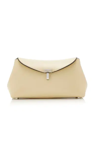 Toteme Mini T-Lock Leather Clutch | Thumbnail 1 Toteme Mini T-Lock Leather Clutch | Thumbnail 1