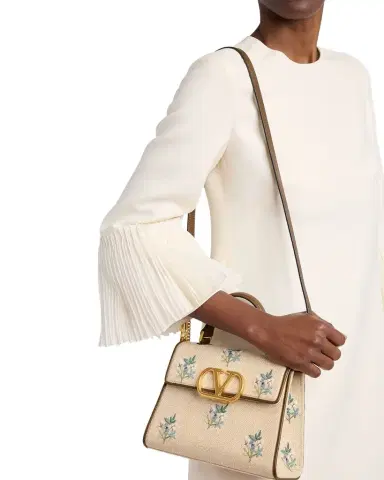 Valentino Garavani Small Floral-Embroidered Woven Flax Top-Handle Bag | Thumbnail 1 Valentino Garavani Small Floral-Embroidered Woven Flax Top-Handle Bag | Thumbnail 1