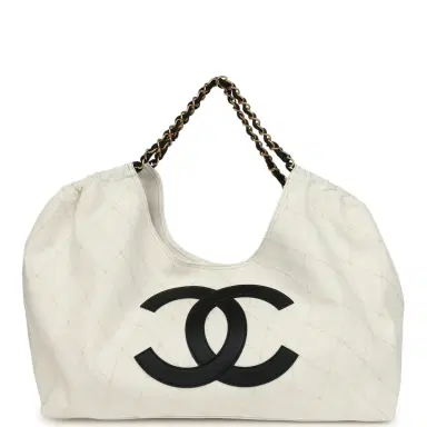 Chanel Chanel Maxi Coco Beach Cambon Hobo Bag White Denim and Black Calfskin Brushed Gold Hardware | Thumbnail 1 Chanel Chanel Maxi Coco Beach Cambon Hobo Bag White Denim and Black Calfskin Brushed Gold Hardware | Thumbnail 1