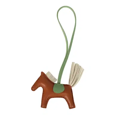HERMÈS Hermes Rodeo Bag Charm PM Gold, Craie, Vert Criquet Milo Lambskin | Thumbnail 1 HERMÈS Hermes Rodeo Bag Charm PM Gold, Craie, Vert Criquet Milo Lambskin | Thumbnail 1