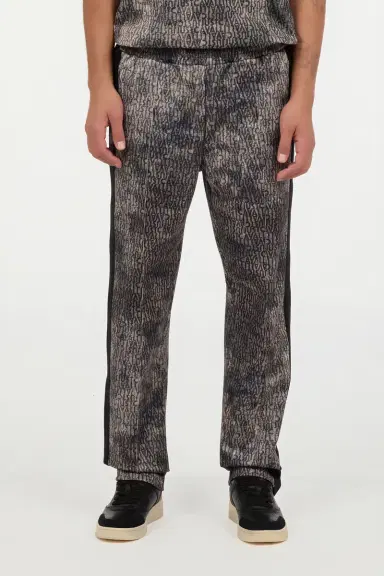 Roberto Cavalli Faded Effect Trousers With All-Over Lettering | Thumbnail 2 Roberto Cavalli Faded Effect Trousers With All-Over Lettering | Thumbnail 2