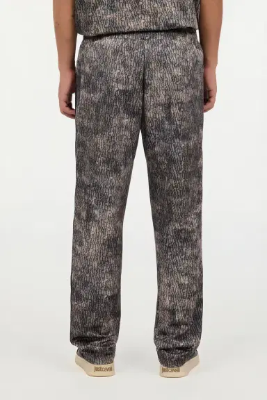 Roberto Cavalli Faded Effect Trousers With All-Over Lettering | Thumbnail 3 Roberto Cavalli Faded Effect Trousers With All-Over Lettering | Thumbnail 3