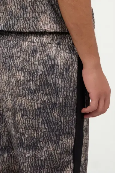 Roberto Cavalli Faded Effect Trousers With All-Over Lettering | Thumbnail 6 Roberto Cavalli Faded Effect Trousers With All-Over Lettering | Thumbnail 6