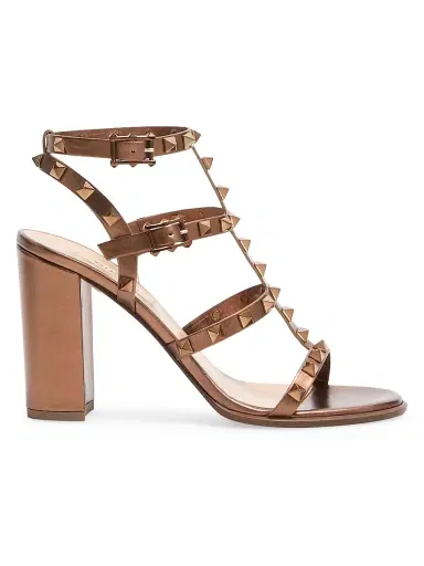 Valentino Garavani Women's Rockstud Metallic 90MM Calfskin Leather Ankle Strap Sandals - Bronze | Thumbnail 1 Valentino Garavani Women's Rockstud Metallic 90MM Calfskin Leather Ankle Strap Sandals - Bronze | Thumbnail 1