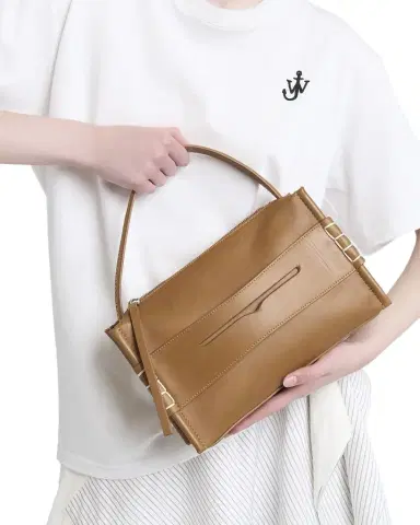 JW Anderson Penny Loafer Leather Top-Handle Bag | Thumbnail 1 JW Anderson Penny Loafer Leather Top-Handle Bag | Thumbnail 1