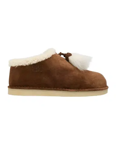 Miu Miu Suede Shearling-Lined Booties with Fur Tassels | Thumbnail 1 Miu Miu Suede Shearling-Lined Booties with Fur Tassels | Thumbnail 1