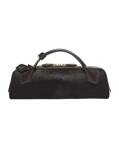 Alaïa Elongated Calf Hair Clutch Bag | Thumbnail 1 Alaïa Elongated Calf Hair Clutch Bag | Thumbnail 1