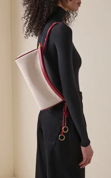 Alaïa Le Click E/W Leather-Trimmed Bag | Thumbnail 2 Alaïa Le Click E/W Leather-Trimmed Bag | Thumbnail 2
