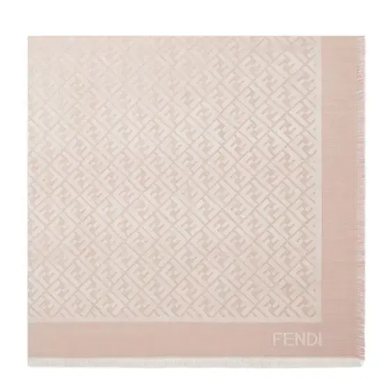 The iconic shawl is made of a pink wool and organic The iconic shawl is made of a pink wool and organic