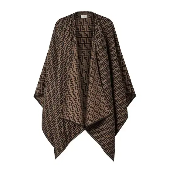 Lightweight poncho with enveloping volumes Lightweight poncho with enveloping volumes