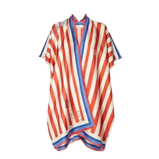 Wraparound poncho with ribbons to tie at the sides Wraparound poncho with ribbons to tie at the sides