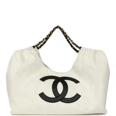 Chanel Chanel Maxi Coco Beach Cambon Hobo Bag White Denim and Black Calfskin Brushed Gold Hardware | Thumbnail 1 Chanel Chanel Maxi Coco Beach Cambon Hobo Bag White Denim and Black Calfskin Brushed Gold Hardware | Thumbnail 1