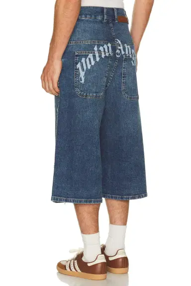 Palm Angels Curved Logo Denim Skater Short | Thumbnail 1 Palm Angels Curved Logo Denim Skater Short | Thumbnail 1