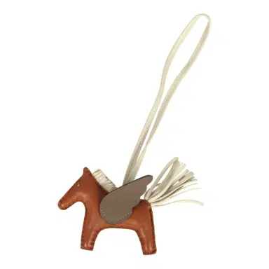 HERMÈS Hermes Pegase Rodeo Bag Charm PM Gold, Craie and Etoupe Milo Lambskin | Thumbnail 1 HERMÈS Hermes Pegase Rodeo Bag Charm PM Gold, Craie and Etoupe Milo Lambskin | Thumbnail 1