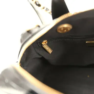 Chanel Pre-owned Chanel "CC Travel" Bowling Bag Black Shiny Crumped Calfskin Antique Gold Hardware | Thumbnail 13 Chanel Pre-owned Chanel "CC Travel" Bowling Bag Black Shiny Crumped Calfskin Antique Gold Hardware | Thumbnail 13