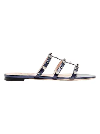 Valentino Garavani Women's Rockstud Slide Sandals in Laminated Nappa with Cabochon - Navy | Thumbnail 1 Valentino Garavani Women's Rockstud Slide Sandals in Laminated Nappa with Cabochon - Navy | Thumbnail 1
