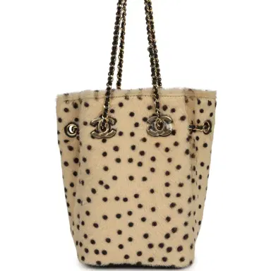 Chanel Chanel Mini "Cheetah Print" Bucket Bag with Chain Light Beige Calf Hair and Black Lambskin Gold Hardware | Thumbnail 1 Chanel Chanel Mini "Cheetah Print" Bucket Bag with Chain Light Beige Calf Hair and Black Lambskin Gold Hardware | Thumbnail 1
