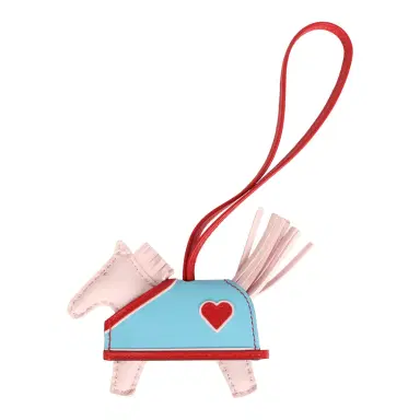 HERMÈS Hermes Rodeo Robeo Coeur Charm PM Rose Darling, Bleu Celeste & Rouge Radieux Milo Lambskin | Thumbnail 1 HERMÈS Hermes Rodeo Robeo Coeur Charm PM Rose Darling, Bleu Celeste & Rouge Radieux Milo Lambskin | Thumbnail 1