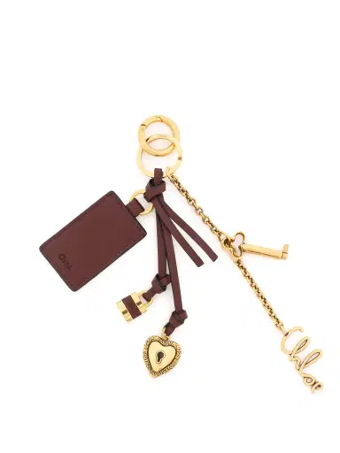 Chloé Chloé Symbols Heart & Lock key ring bag charm in brass & leather | Thumbnail 1 Chloé Chloé Symbols Heart & Lock key ring bag charm in brass & leather | Thumbnail 1