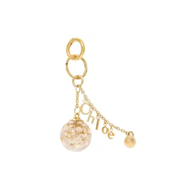 Chloé Chloé Symbols Resin Flowers & Logo key ring bag charm in brass | Thumbnail 1 Chloé Chloé Symbols Resin Flowers & Logo key ring bag charm in brass | Thumbnail 1