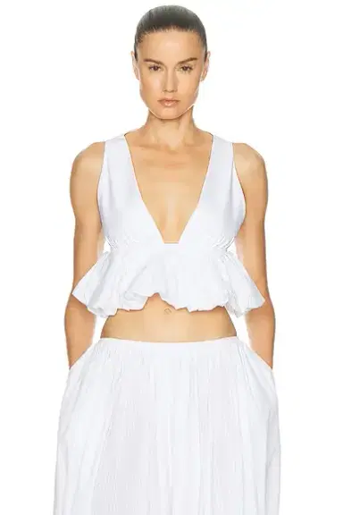 ALAÏA Peplum Openwork Crop Top | Thumbnail 1 ALAÏA Peplum Openwork Crop Top | Thumbnail 1