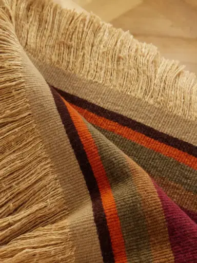 The House of Lyria Grottesco Fringes Striped Woven Throw | Thumbnail 3 The House of Lyria Grottesco Fringes Striped Woven Throw | Thumbnail 3