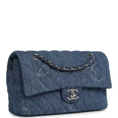 Chanel Pre-owned Chanel Medium Classic "CC Printed" Flap Bag Blue Denim Silver Hardware | Thumbnail 2 Chanel Pre-owned Chanel Medium Classic "CC Printed" Flap Bag Blue Denim Silver Hardware | Thumbnail 2