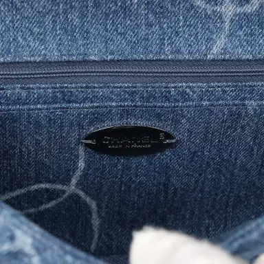 Chanel Pre-owned Chanel Medium Classic "CC Printed" Flap Bag Blue Denim Silver Hardware | Thumbnail 8 Chanel Pre-owned Chanel Medium Classic "CC Printed" Flap Bag Blue Denim Silver Hardware | Thumbnail 8