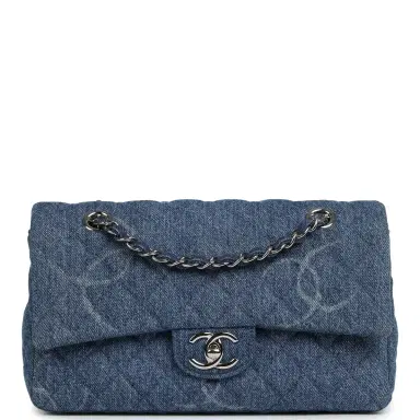 Chanel Pre-owned Chanel Medium Classic "CC Printed" Flap Bag Blue Denim Silver Hardware | Thumbnail 1 Chanel Pre-owned Chanel Medium Classic "CC Printed" Flap Bag Blue Denim Silver Hardware | Thumbnail 1