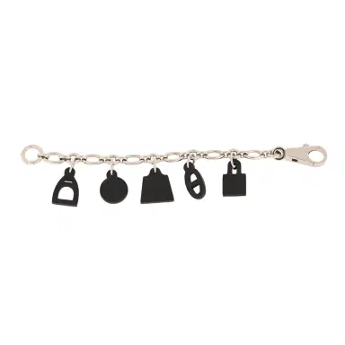 HERMÈS Pre-owned Hermes Olga Bag Charm Black Barenia Palladium Hardware | Thumbnail 1 HERMÈS Pre-owned Hermes Olga Bag Charm Black Barenia Palladium Hardware | Thumbnail 1
