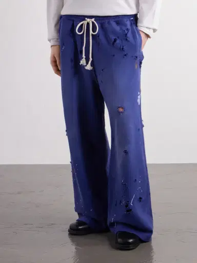 Satoshi Nakamoto Luke Logo-Printed Paint-Splattered Distressed Cotton-Jersey Drawstring Sweatpants - Men | Thumbnail 3 Satoshi Nakamoto Luke Logo-Printed Paint-Splattered Distressed Cotton-Jersey Drawstring Sweatpants - Men | Thumbnail 3