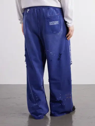 Satoshi Nakamoto Luke Logo-Printed Paint-Splattered Distressed Cotton-Jersey Drawstring Sweatpants - Men | Thumbnail 4 Satoshi Nakamoto Luke Logo-Printed Paint-Splattered Distressed Cotton-Jersey Drawstring Sweatpants - Men | Thumbnail 4