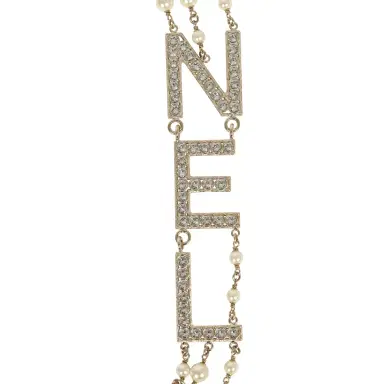 Chanel Chanel Long Crystal CHA-NEL Multi-Strand CC Pearl Necklace Ivory Pearls, Light Gold Tone Hardware | Thumbnail 4 Chanel Chanel Long Crystal CHA-NEL Multi-Strand CC Pearl Necklace Ivory Pearls, Light Gold Tone Hardware | Thumbnail 4