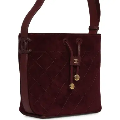 Chanel Chanel Small "CC Loop" Drawstring Bucket Bag with Leather Strap Dark Burgundy Suede, Calfskin Gold Hardware | Thumbnail 2 Chanel Chanel Small "CC Loop" Drawstring Bucket Bag with Leather Strap Dark Burgundy Suede, Calfskin Gold Hardware | Thumbnail 2