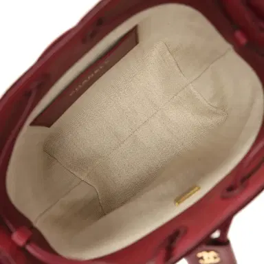 Chanel Chanel Small "CC Loop" Drawstring Bucket Bag with Leather Strap Dark Burgundy Suede, Calfskin Gold Hardware | Thumbnail 11 Chanel Chanel Small "CC Loop" Drawstring Bucket Bag with Leather Strap Dark Burgundy Suede, Calfskin Gold Hardware | Thumbnail 11