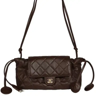 Chanel Chanel Drawstring Flap Bag with Leather Strap Dark Brown Lambskin Gold Hardware | Thumbnail 1 Chanel Chanel Drawstring Flap Bag with Leather Strap Dark Brown Lambskin Gold Hardware | Thumbnail 1